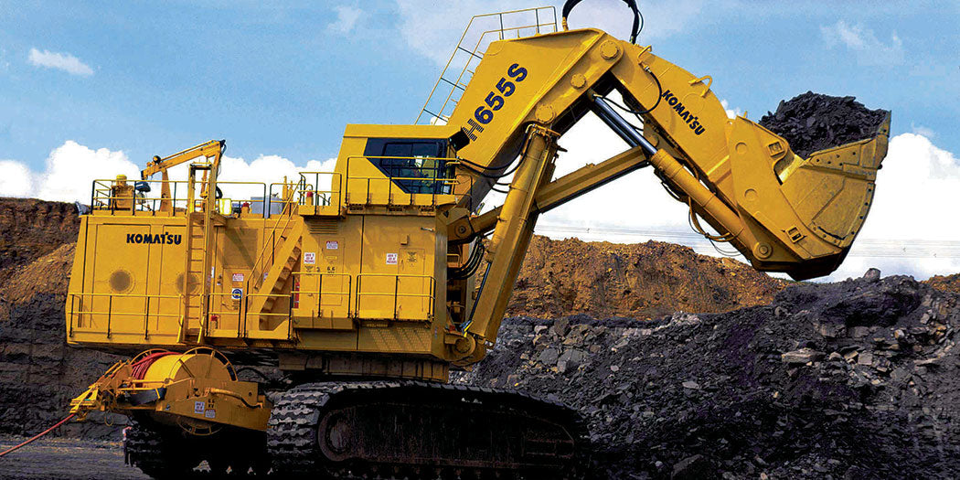 Large front-end loader in operation, illustrating LubeLine lubricants for heavy machinery and industrial equipment