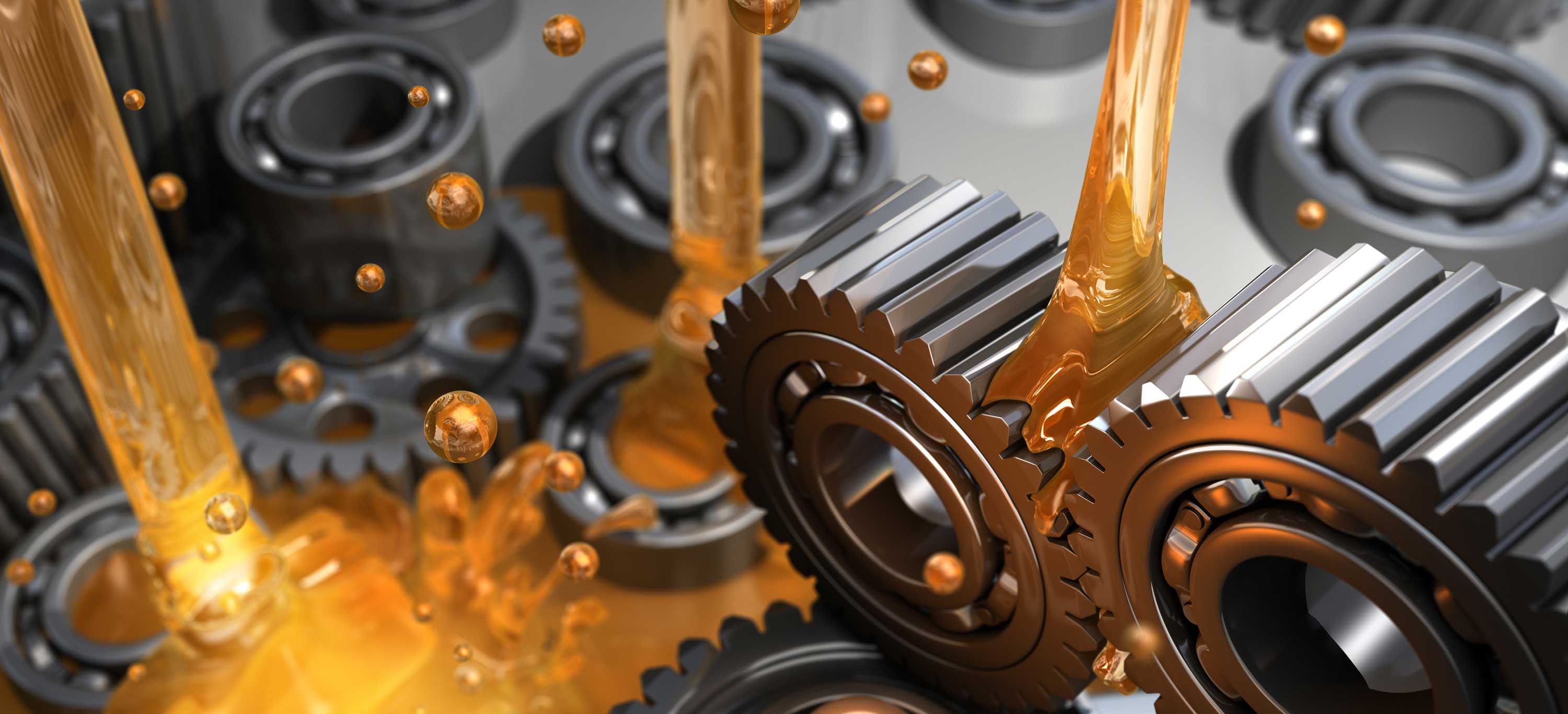 Industrial gear oil flowing over meshing gears