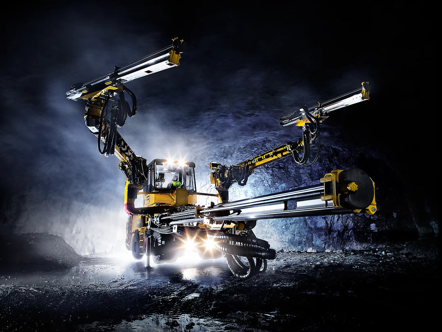 Mining drilling machine in operation, illustrating LubeLine lubricants for heavy-duty mining equipment