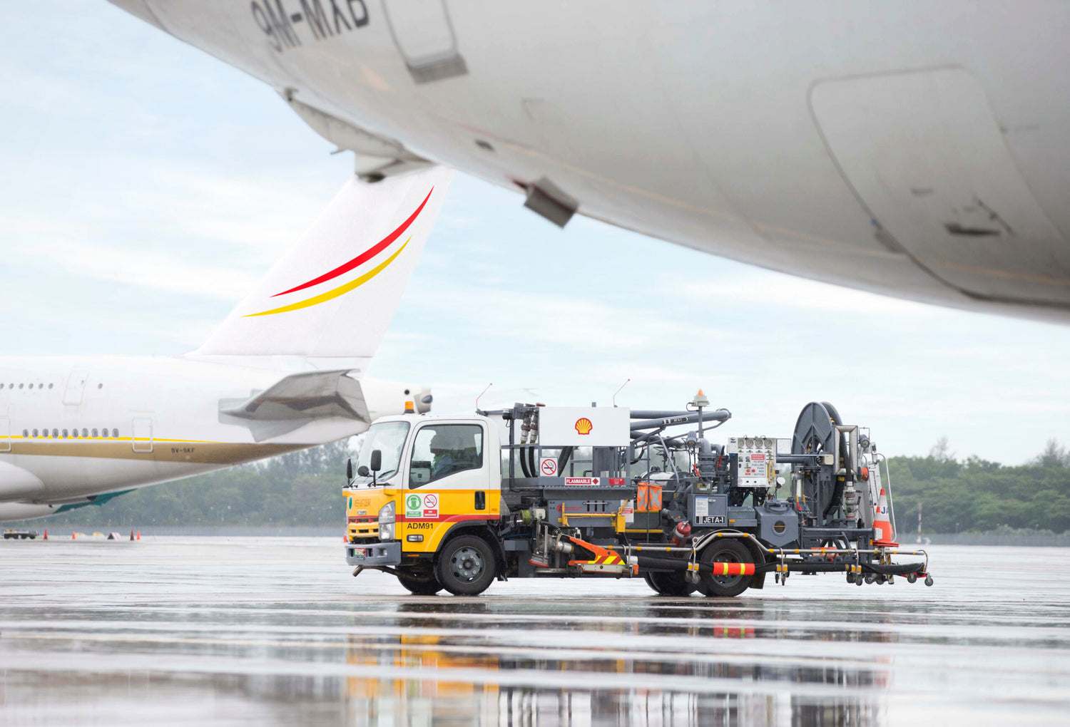Shell aviation refueling truck on an airport runway, illustrating LubeLine’s fuel and lubricant distribution for the aviation sector